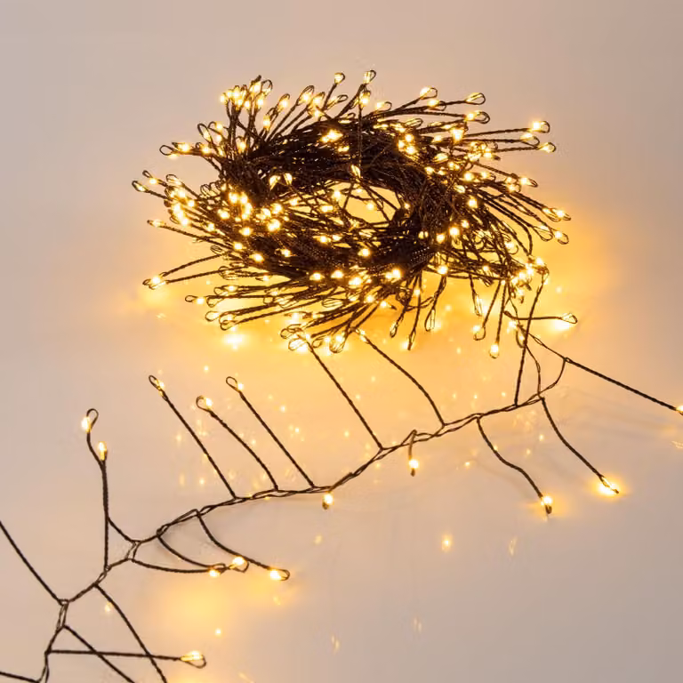 Guirnalda de fuegos artificiales Spetebo con 480 LEDs en blanco cálido, temporizador y alimentación por red para Navidad