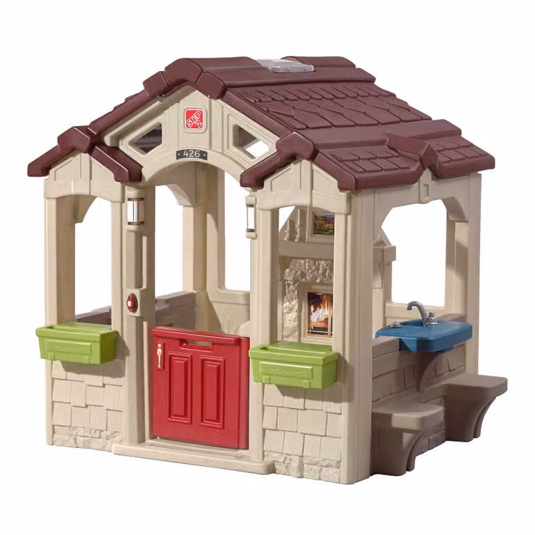 Casita de juegos Step2 Charming Cottage de plástico multicolor con cocina, chimenea y zona picnic para exterior