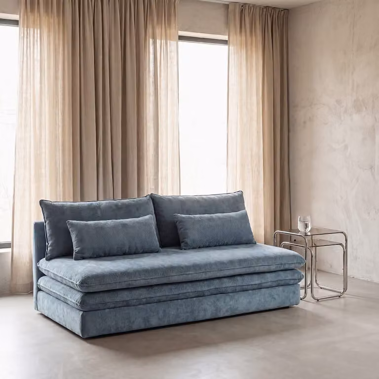Sofá cama click clack de 2 o 3 plazas Maisons du Monde en color azul petróleo con arcón de tela y estructura de madera
