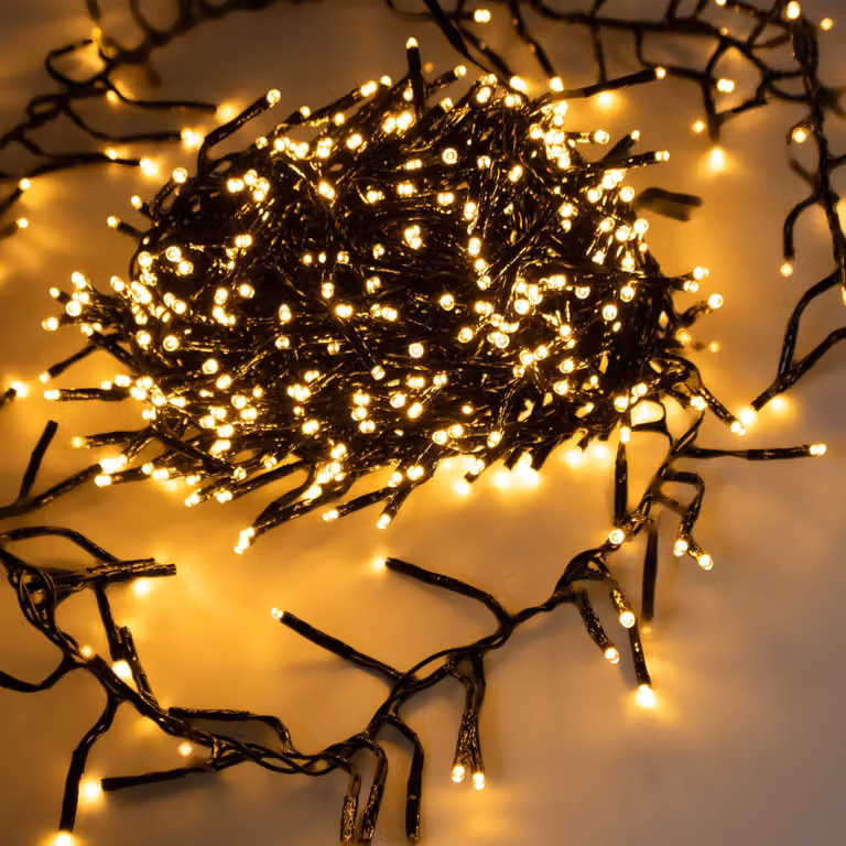 Guirnalda de luces navideñas Spetebo Büschel con 768 LEDs en color blanco cálido, longitud de 7 m, regulable con temporizador y acabado en dorado suave
