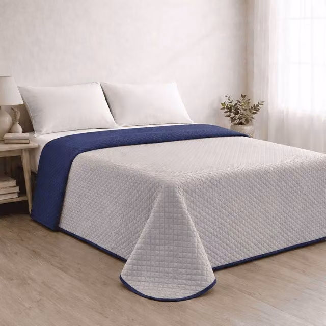 Colcha reversible acolchada Donegal Collections bicolor azul y gris para cama de 180 cm