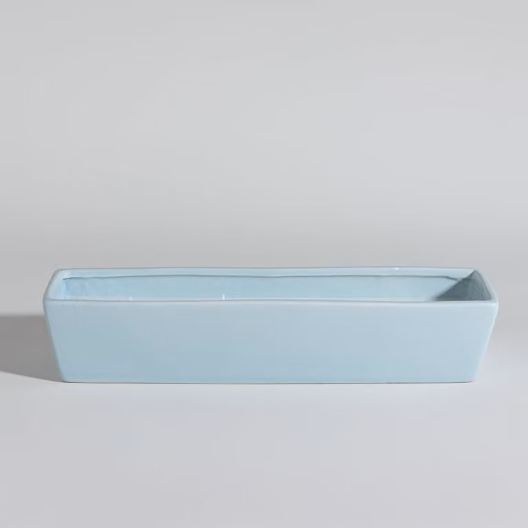 Vela perfumada Aqua verano de Maisons du Monde en recipiente de cerámica azul con aroma floral y frutal
