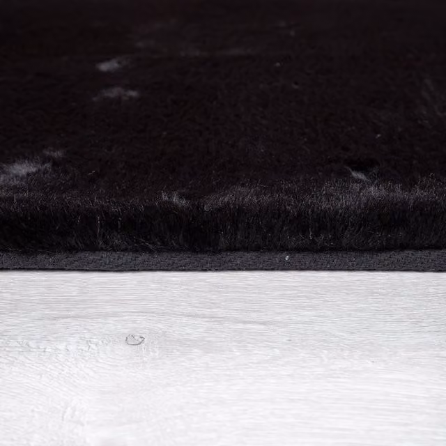 Alfombra de piel sintética Fluffy negra de forma ovalada, An/P: 150 x 170 cm