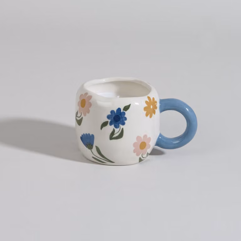 Vela perfumada de Maisons du Monde en cerámica multicolor con aroma a polvo floral para mesa