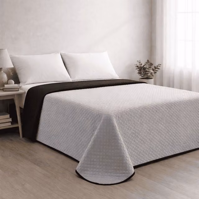 Colcha reversible acolchada Donegal Collections en gris y negro para cama de 105 cm